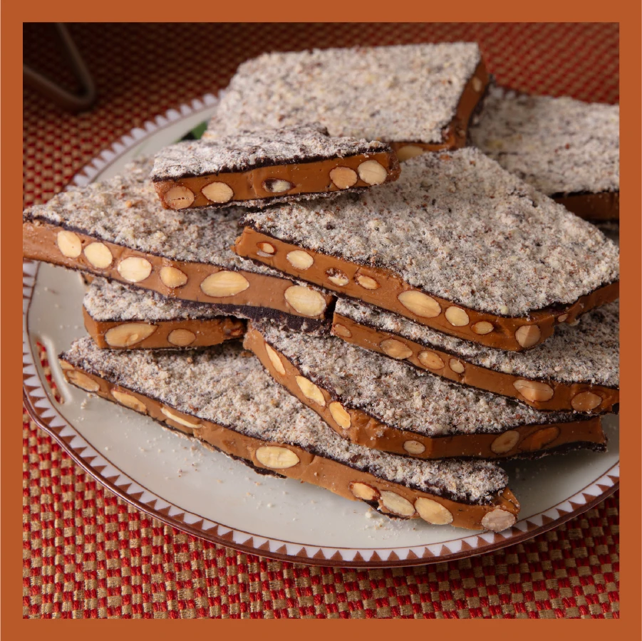 Traditional Almond Toffee in Dark Chocolate on Fall tablescape