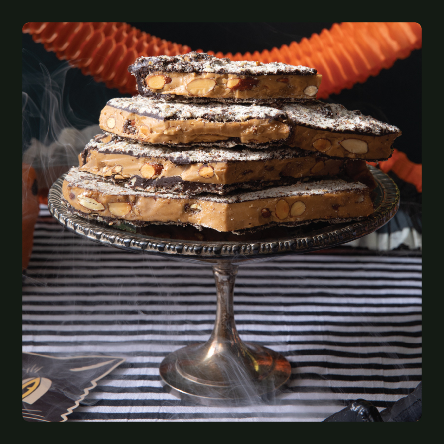 Dark Chocolate Almond Toffee on Cake Stand and Halloween Decor