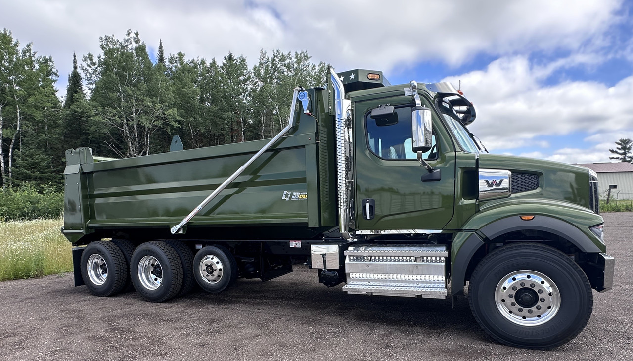 Green Western Star tri-axle dump truck with steel dump body side profile