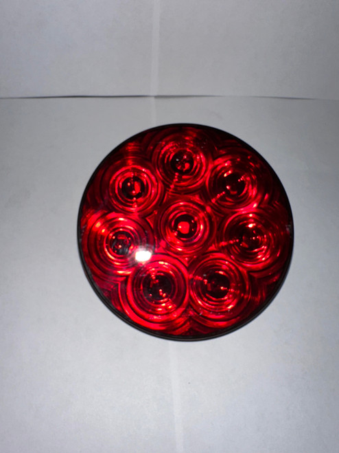 High-resolution image of the TecNiq T46-RR0A-1 4″ round red lens LED Stop/Tail/Turn light.