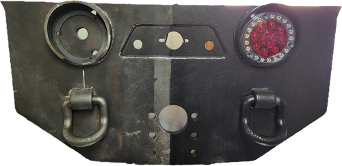 Heavy-duty pintle hitch plate assembly with 50-ton pintle hook, trailer air gladhands, integrated lighting, and 7-pin electrical socket mounted on a vocational truck.