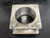 Beau-Roc 49-58304 5-inch 304 stainless steel dump body exhaust heat spring plate with a central exhaust opening and four compression springs.
