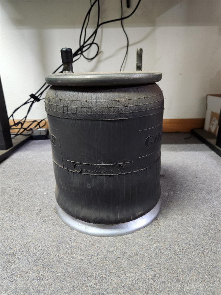 Ridewell 1001R12617G air spring – rolling-lobe heavy-duty trailer suspension component. Ridewell 1001R12617G air spring – rolling-lobe heavy-duty trailer suspension component.