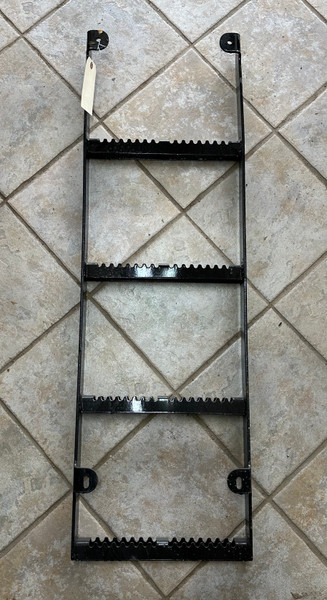 Steel bolt-on dump box ladder with 4 serrated steps and black painted finish, designed for dump bodies and trailers. Steel bolt-on dump box ladder with 4 serrated steps and black painted finish, designed for dump bodies and trailers.