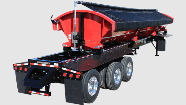 Detailed image of the Aero SideKick 2.0 tarp system on a 36ft side dump trailer, showing pivot box, drive system, and hardware (tarp not included).