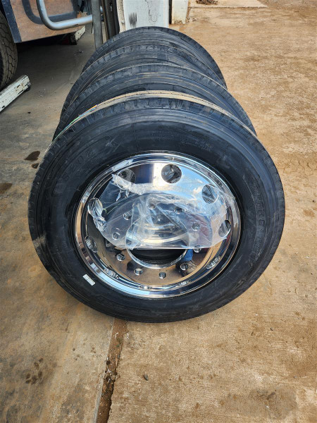Low profile 22.5 aluminum wheel and tire assembly with 255/70R22.5 tire used on steerable lift axle truck setups.