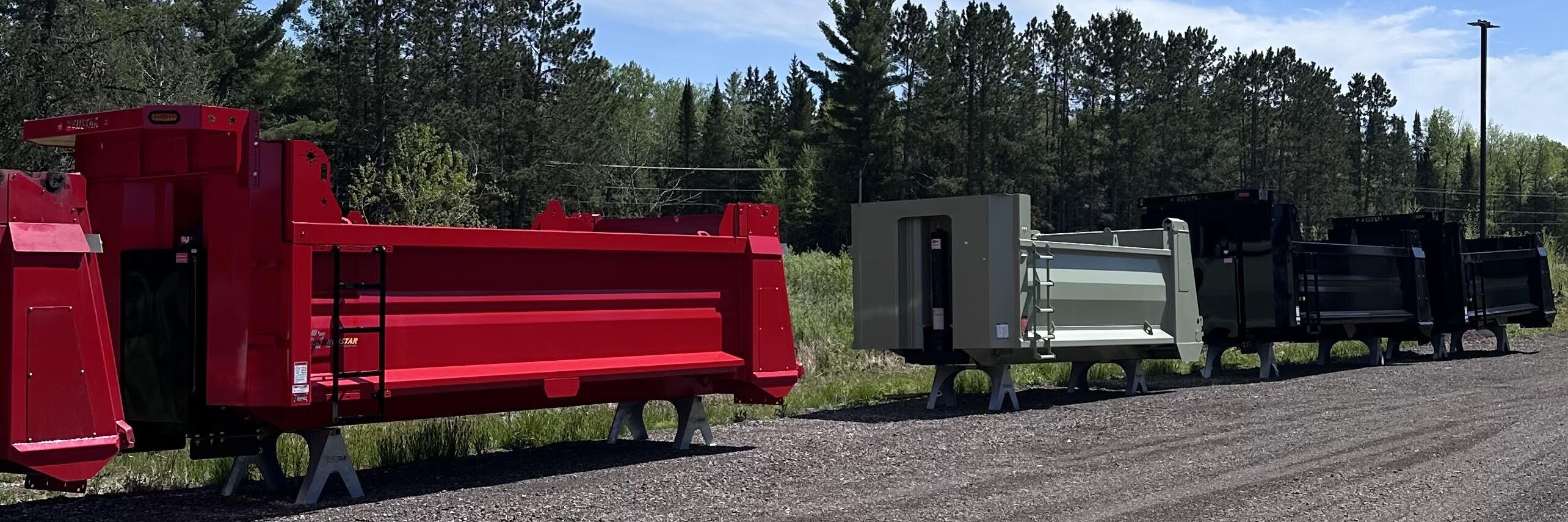 Dump bodies lined up at Don Dens Sales