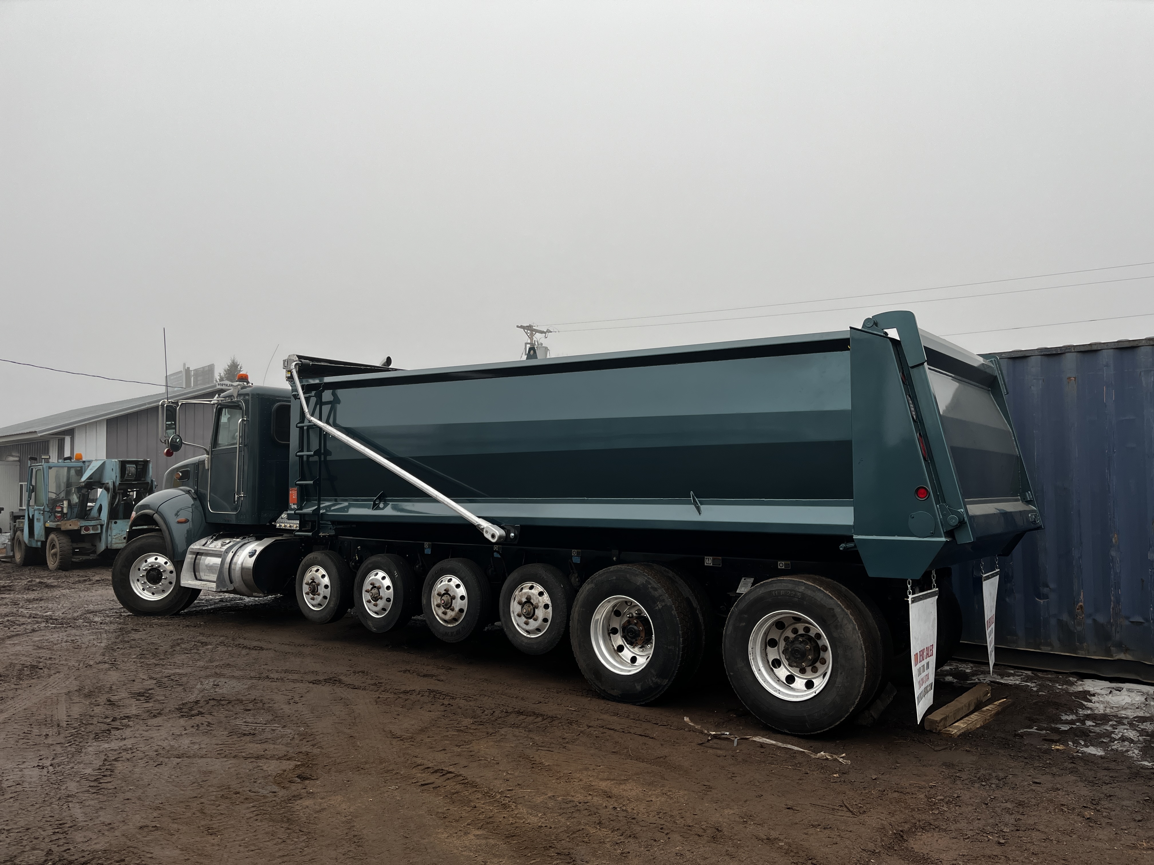 Dump body installation and vocational truck upfitting