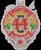 A firefighter badge features flames around the number "44," surrounded by tools and clovers. It reads: â€œFIRE 44,â€ â€œQUARTERS,â€ â€œFLATBUSH,â€ â€œTHE NUT HOUSE,â€ with a black background.