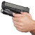 A black handgun is held by a person's hand against a plain white background. The gun features an additional mounted light or laser device below the barrel.