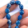 12x9mm Blue Faceted Thunder Polish Ovals (17pc Strand)