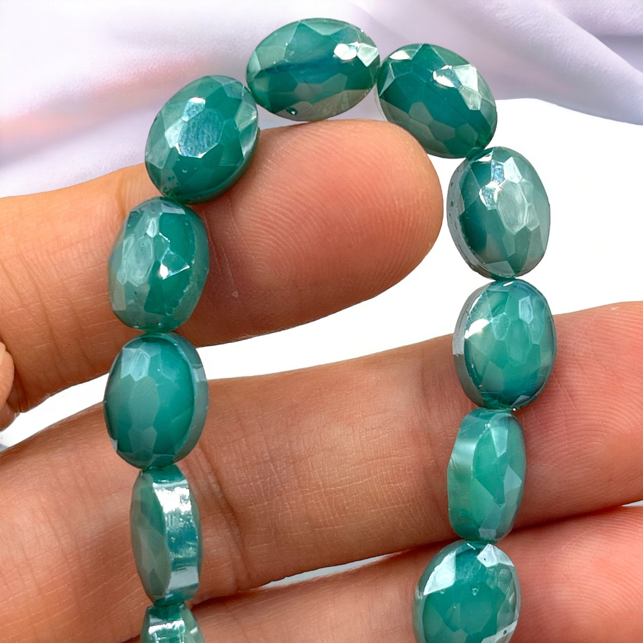 12x9mm milky Blue Green Faceted Thunder Polish Ovals (17pc Strand)