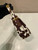 Prada  Arqué printed leather mini shoulder bag 1BC194 Honey White