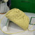 BV 585852 Bottega Veneta Mini Pouch intrecciato leather clutch with strap Light Yellow