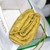 BV 585852 Bottega Veneta Mini Pouch intrecciato leather clutch with strap Yellow