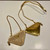 Prada 1NR015 Embellished satin and leather mini-pouch Gold