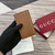 Gucci 818953 GG Emblem bi-fold embossed card case Brown