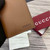 Gucci 818953 GG Emblem bi-fold embossed card case Brown