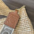 Loewe Slit pochette bag in raffia and calfskin 32824W10