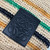 Loewe Slit pochette bag in raffia and calfskin 32824W10 Black