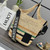 Loewe Slit pochette bag in raffia and calfskin 32824W10 Black