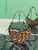 Prada 1BC194 Prada Arqué printed leather shoulder bag Honey