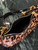 Prada 1BC194 Prada Arqué printed leather shoulder bag Honey