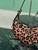 Prada 1BC194 Prada Arqué printed leather shoulder bag Honey