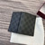 Gucci 821209 GG Emblem bi-fold card case Black