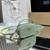 Prada 1NR025 Crochet and leather mini-pouch Green