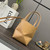 Loewe A657V25X01  Mini Puzzle Fold tote in shiny calfskin Apricot Yellow
