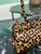 Prada 1BA426 Medium printed leather handbag Honey