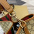 Gucci 815103 GG Emblem bucket bag Beige and dark brown