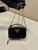 Prada 1NR025 Patent leather mini-pouch Black
