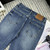 Chanel Women Double C logo print flared denim trousers Jeans C58813