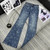 Chanel Women Double C logo print flared denim trousers Jeans C58813