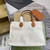 Gucci 772176 Medium Tote Bag With Gucci Print Light brown leather trim