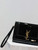 YSL 617662 Cassandre Matelassé Flap pouch in Black Patent leather