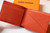 Louis Vuitton Multiple Wallet LV M80422 Monogram Shadow Leather Orange Red