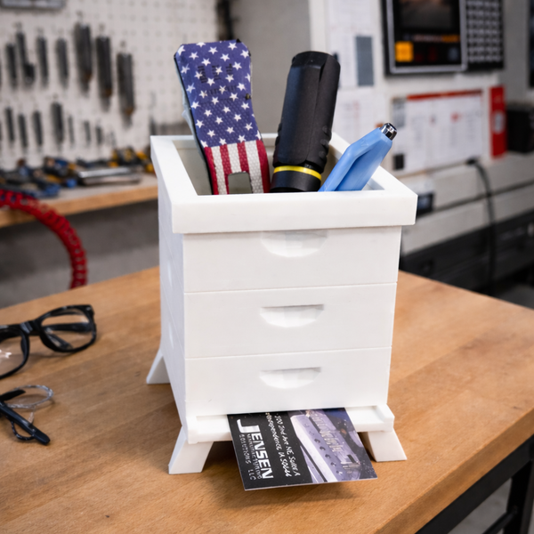 Compact 3D printed desk hive designed to hold cutters, pens, and small tools. A simple organizer for CNC shops, workbenches, and everyday desk setups.