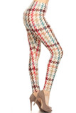 Right side view image of our Buttery Soft Earth Tone Pixel Zags Plus Size Leggings with a retro muted tone larger scale houndstooth striped design i brown, nude, red, and blue tones on a white background.