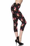 Right side view image of Buttery Smooth Twinkle Unicorn Plus Size Capris featuring a design of white unicorn heads with pink manes and yellow stars against a black background