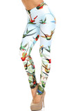 45 degree view of Creamy Soft Happy Hummingbirds Extra Plus Size Leggings - 3X-5X - USA Fashion™ with an amazing colorful bird design contrasting a light blue background.