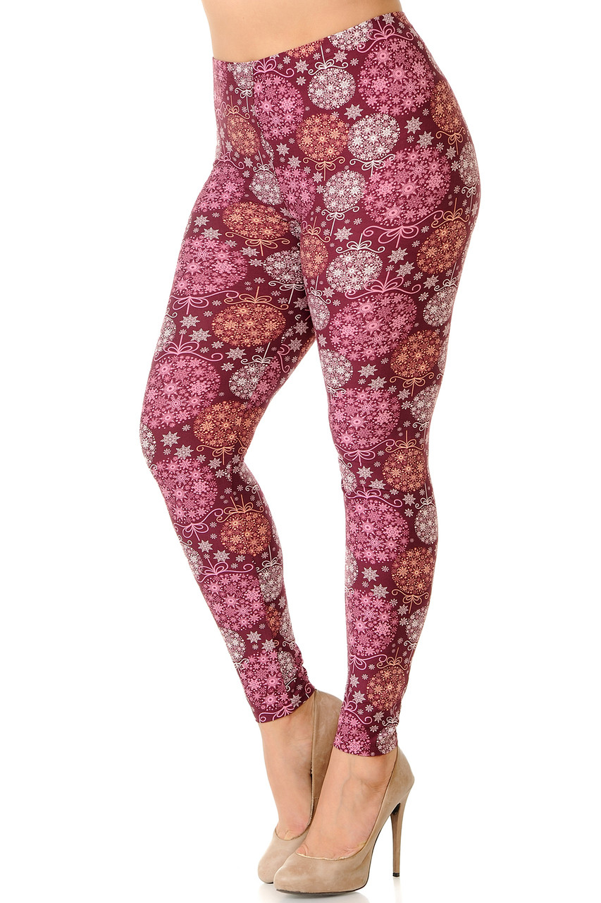 Left side view of our gorgeous burgundy toned Buttery Smooth Festive Snowflake Ornaments Extra Plus Size Leggings with a beautiful intricate all over snowflake print.