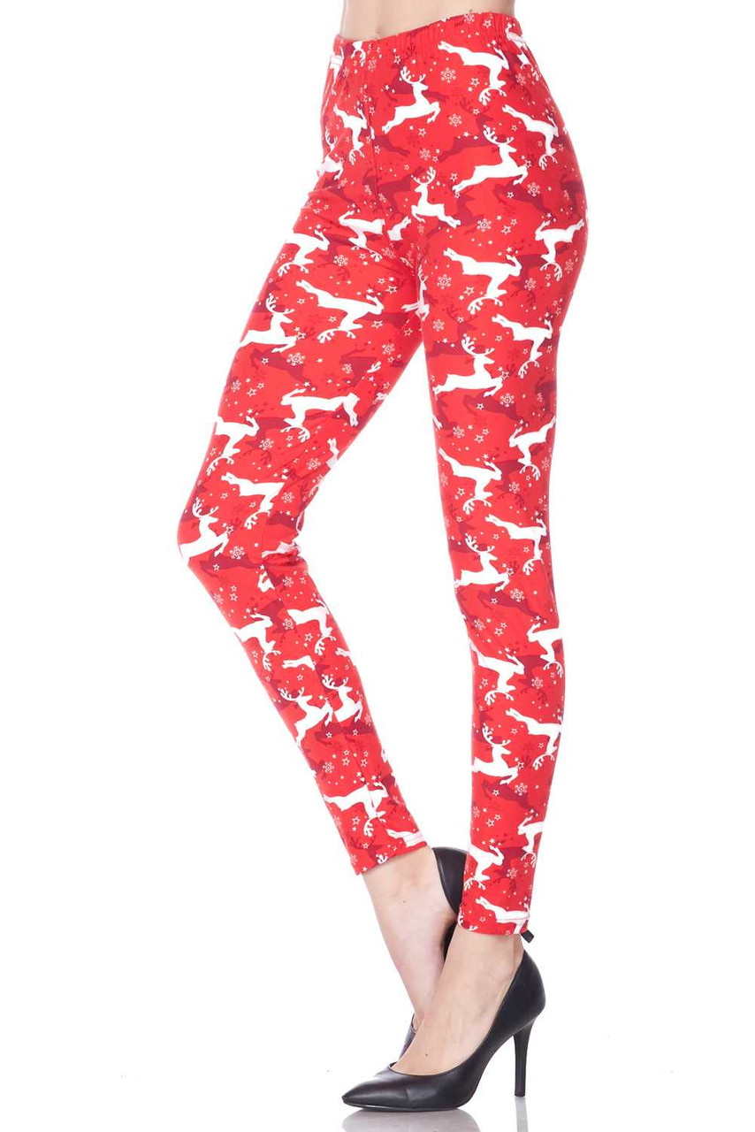 Left side leg image of  Buttery Smooth Ruby Red Leaping Reindeer Christmas Plus Size Leggings