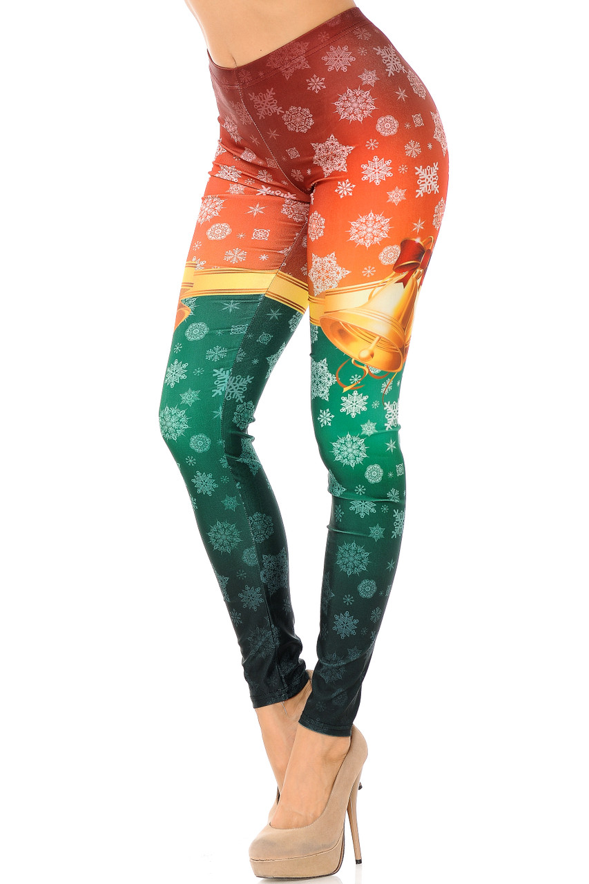 Left side view of Festive Red and Green Split Christmas Bells Leggings with a red upper half, green lower half, separated by golden bells and covered with a snowflake print.