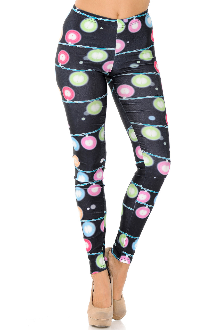 Front view of Festive Holiday Lights Plus Size Leggings with a comfort elastic mid rise waist.