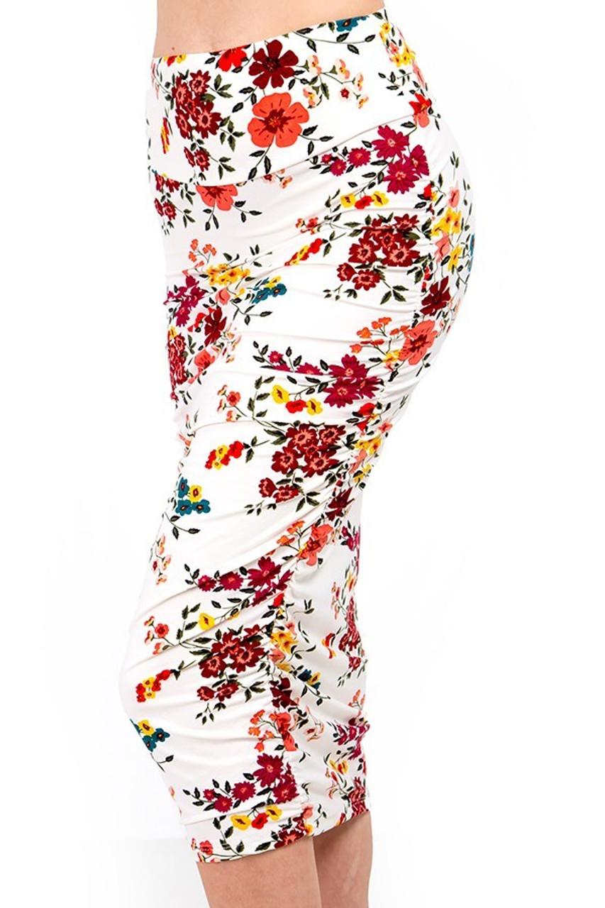 Our Buttery Smooth Fresh Spring Floral Skirt features colorful red , yellow, and teal flowers on a white background.