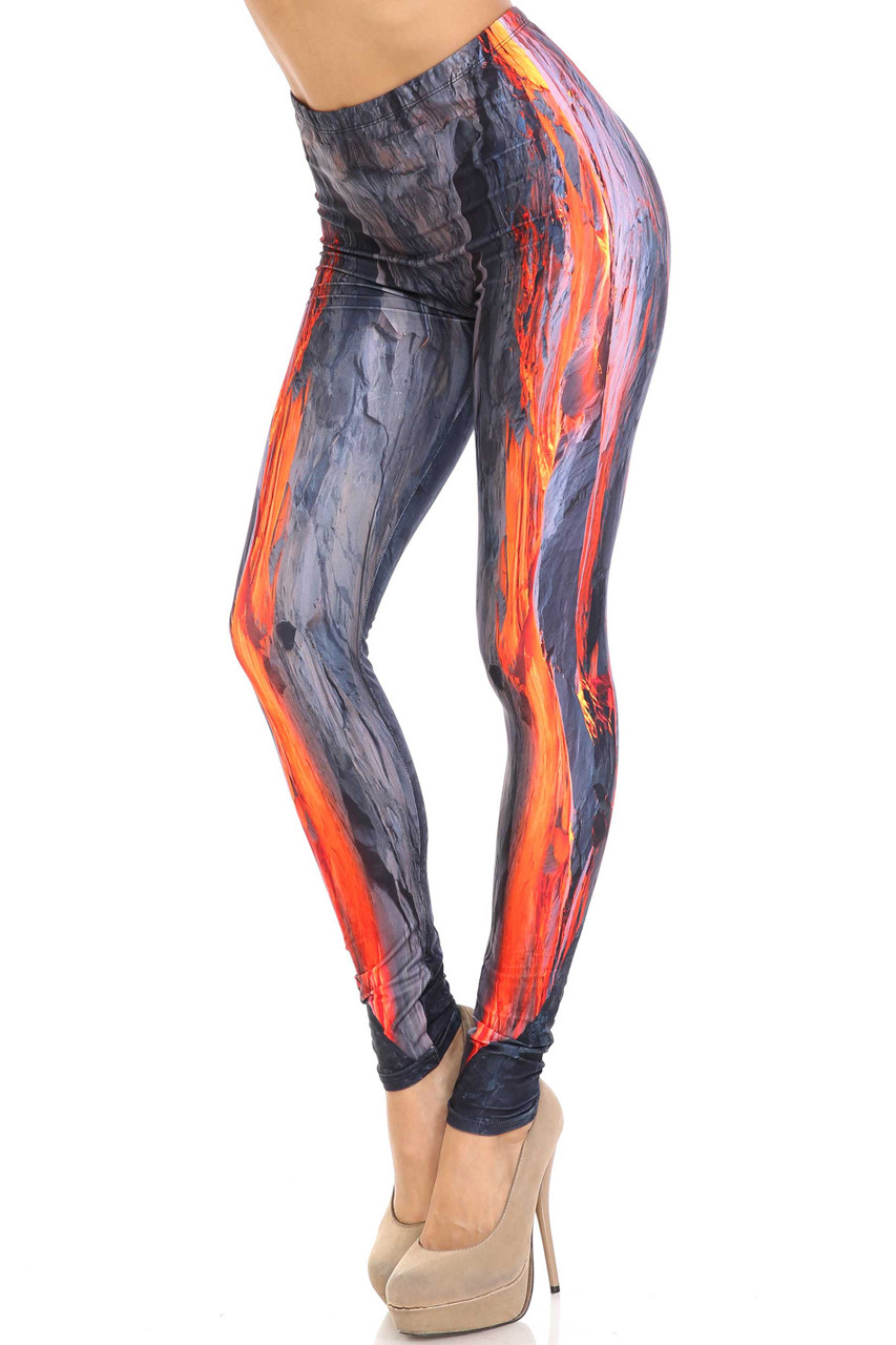 45 degree view of Creamy Soft Hot Lava Plus Size Leggings -  By USA Fashion™ with a bright orange vertical magma design and gray volcanic rock.