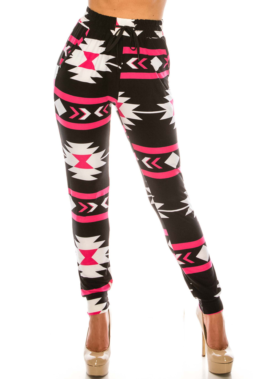 Front view of Buttery Smooth Magenta Aztec Tribal Joggers showing off an eye-catching geometric design in a black, white, and bright pink color scheme.